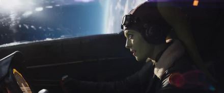 Hera Syndulla piloting her ship with a view of a distant planet, from the TV show Ahsoka (2023). An engaging HD wallpaper that captures her leadership and determination.