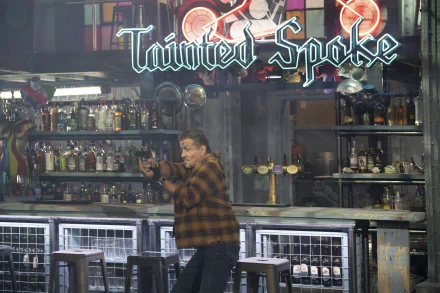 HD wallpaper featuring a scene with a character inside a bar with 'Twisted Spoke' neon sign, evocative of Expendables movies ambiance.