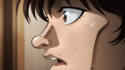 A close-up of Baki Hanma, an anime character, showcasing intense emotion with sweat glistening on his face. This HD desktop wallpaper captures the character's determination vividly.