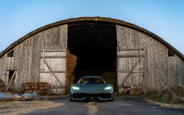Koenigsegg Gemera parked in front of an old barn, HD desktop wallpaper and background.