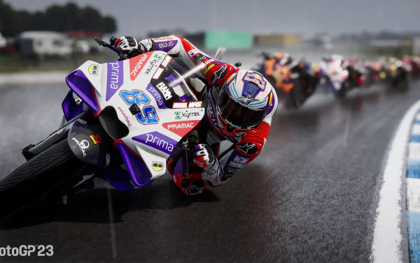 HD desktop wallpaper for MotoGP 23 video game depicting a motorcycle racer leading on a wet track, enhancing the racing intensity.