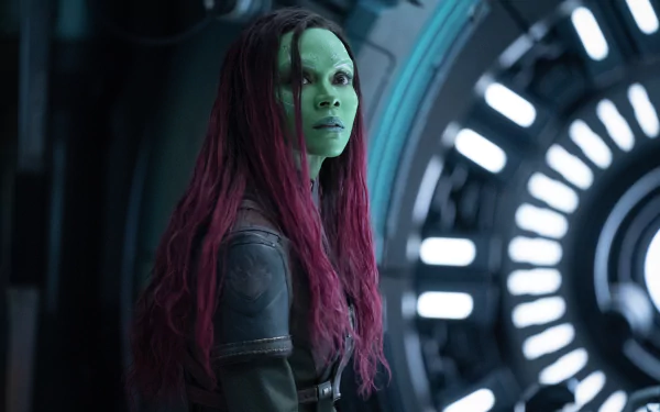 HD wallpaper of Gamora from Guardians of the Galaxy Vol. 3, standing in a spaceship corridor.