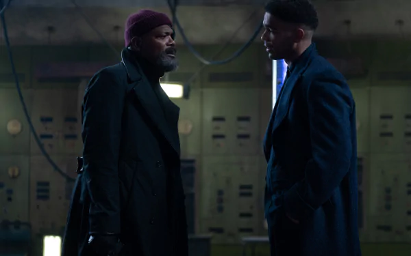 A dramatic scene from the TV show Secret Invasion, featuring Nick Fury, portrayed by Samuel L. Jackson, in a tense conversation with another character. High-definition wallpaper.