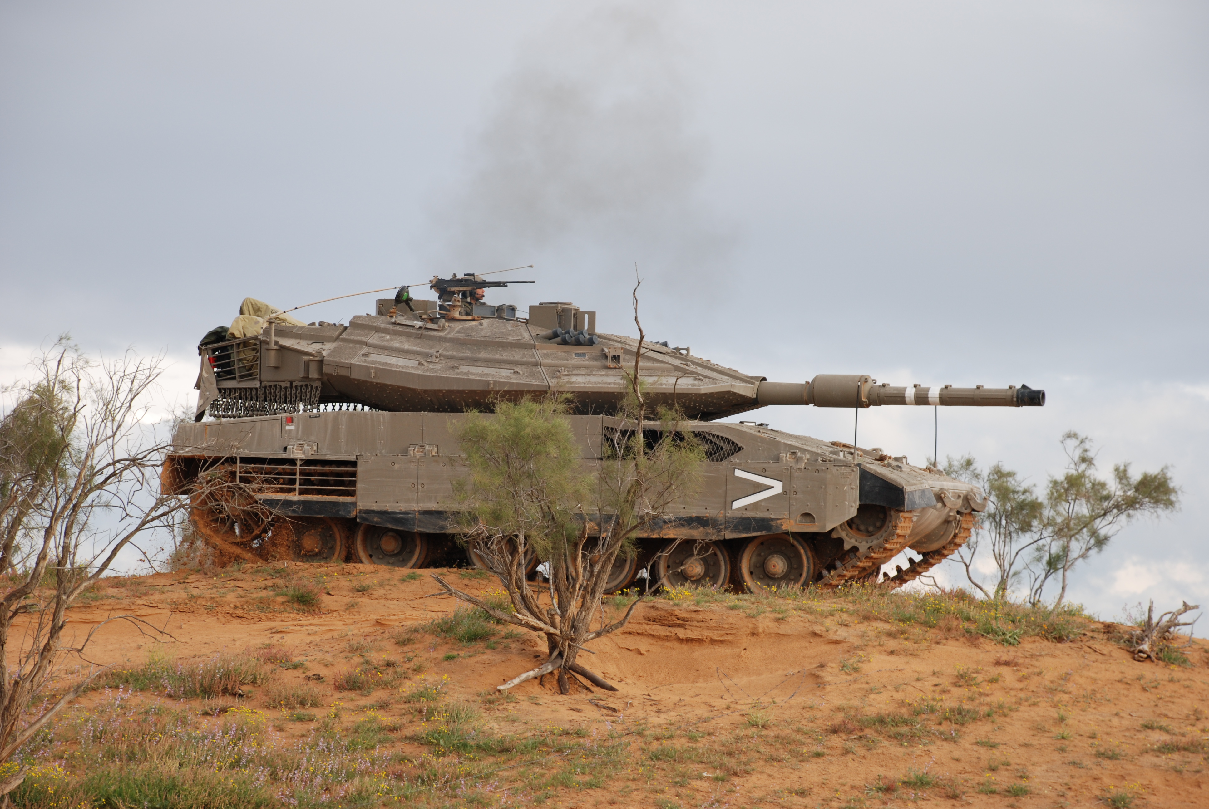 A powerful military tank, named Merkava, in action.