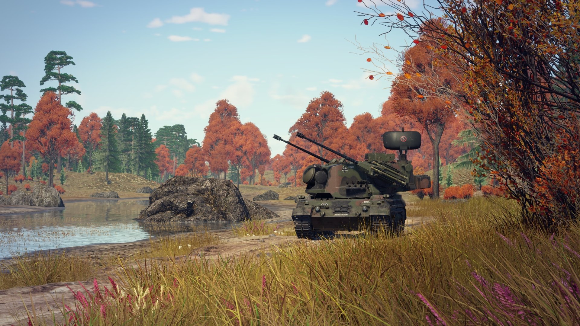 4K Ultra HD War Thunder PC desktop wallpaper featuring an anti-aircraft tank positioned by a lake surrounded by autumn trees and tall grass.