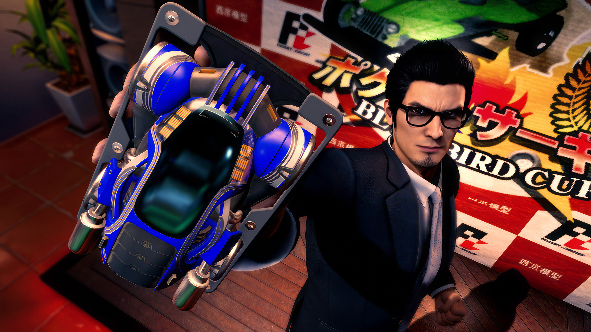 HD desktop wallpaper featuring a character from Like a Dragon Gaiden: The Man Who Erased His Name video game holding a futuristic gadget.