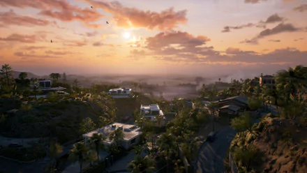 A stunning HD desktop wallpaper from Dead Island 2, showcasing a vibrant sunset over a tropical landscape with lush palm trees and modern homes nestled in the hills.