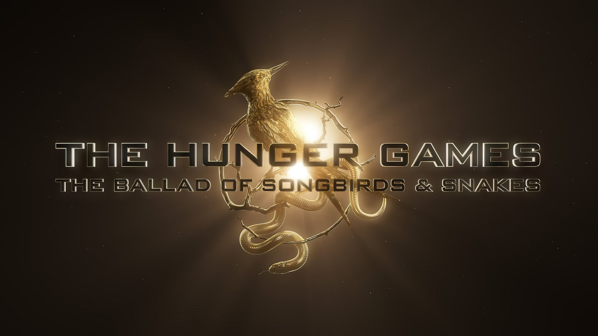 HD wallpaper featuring The Hunger Games: The Ballad of Songbirds & Snakes logo with a golden bird and snake entwined, set against a starlit background.