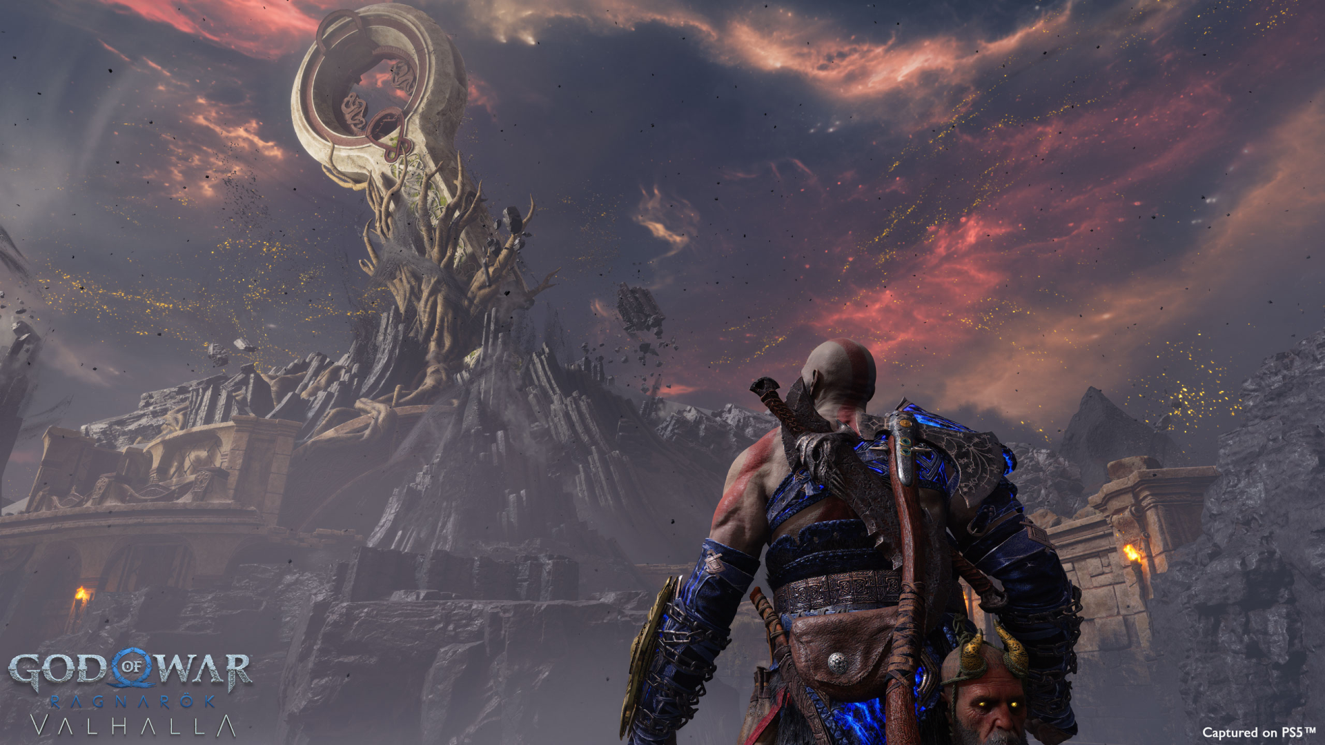 HD desktop wallpaper featuring a scene from God of War: Ragnarök video game with a character facing an epic structure under a dramatic sky.