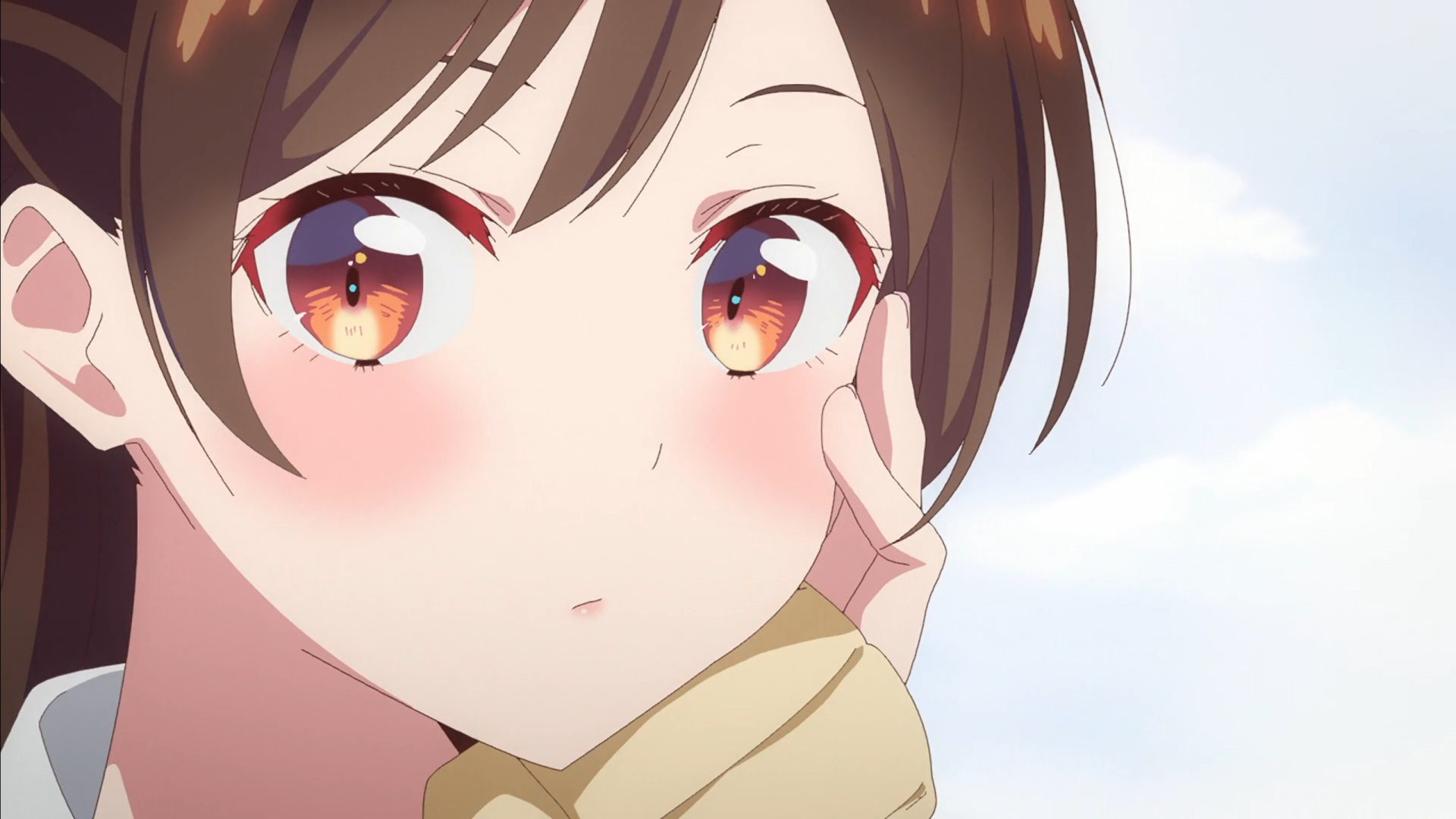 Close-up of Chizuru Ichinose with flushed cheeks and amber eyes against a soft blue sky — 2K Quad HD PC desktop wallpaper/background.