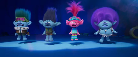 Colorful characters from the movie Trolls Band Together stand together against a vibrant blue background, showcasing their unique hairstyles and joyful expressions in this HD wallpaper.
