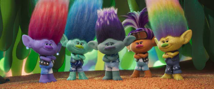 Colorful characters from the movie Trolls Band Together stand confidently with unique hairstyles. This HD wallpaper captures their vibrant and playful spirit.