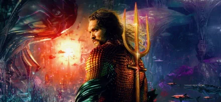 Aquaman from the movie Aquaman and The Lost Kingdom stands holding his trident in an underwater scene, captured in stunning 8K Ultra HD PC desktop wallpaper quality.