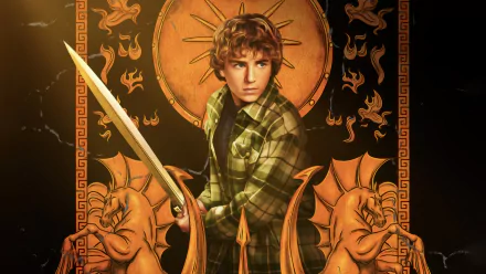 HD desktop wallpaper featuring a character from the TV show 'Percy Jackson and the Olympians,' armed with a sword and set against a mystical golden backdrop with ornate designs.
