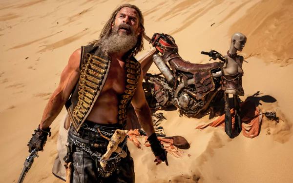 HD desktop wallpaper from Furiosa: A Mad Max Saga, featuring a rugged character in a desert landscape with a motorcycle in the background.
