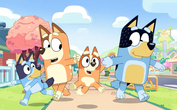 HD desktop wallpaper featuring animated characters from Bluey, joyfully running down a street with colorful houses in the background.