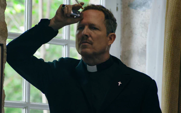 Monsieur Spade TV show character posing as a priest, scrutinizing an object in HD desktop wallpaper.
