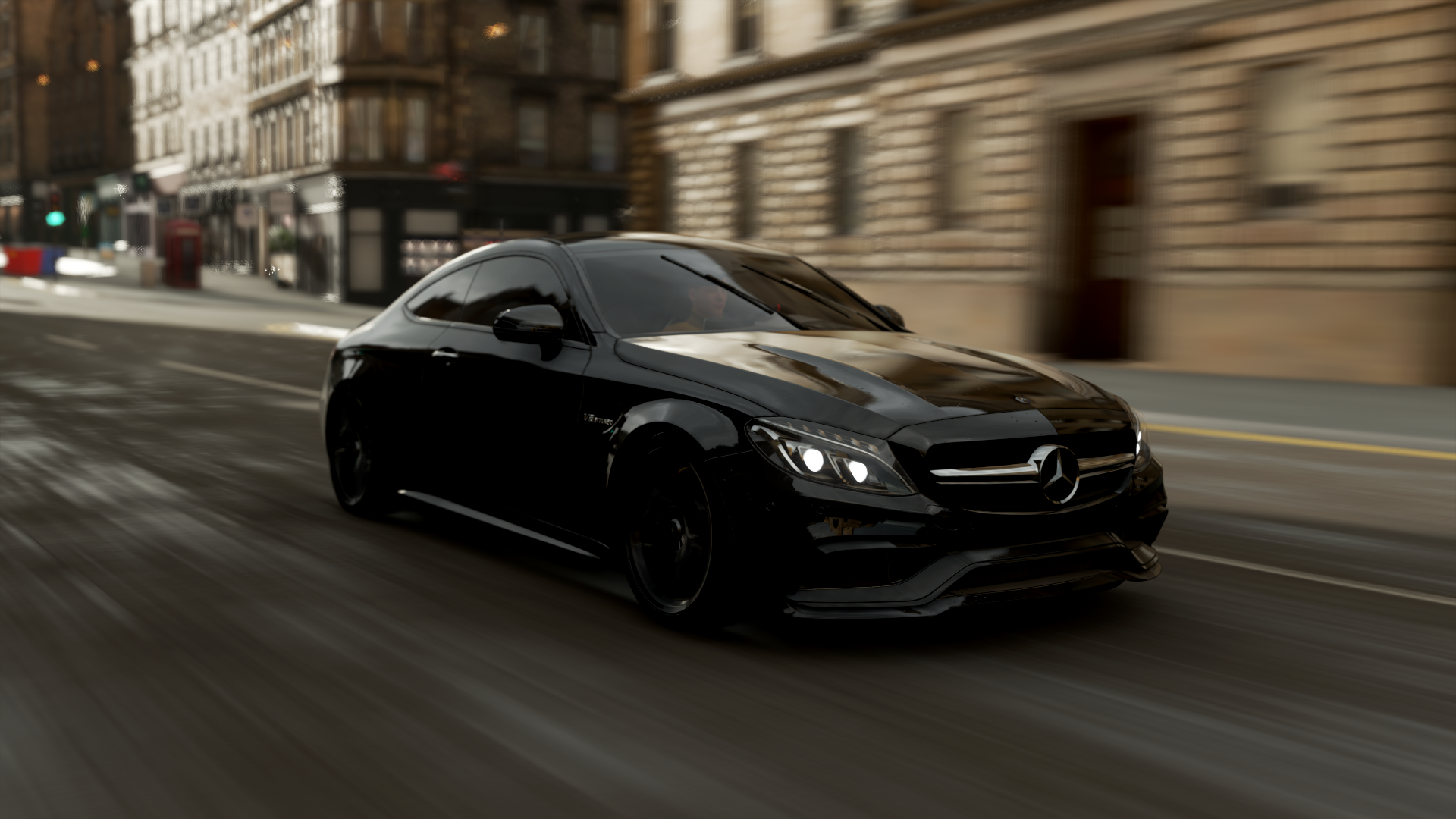 HD PC desktop wallpaper featuring a sleek black Mercedes-Benz car racing through a city street in the video game Forza Horizon 4.