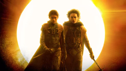 HD desktop wallpaper of Dune: Part Two featuring silhouettes of Timothée Chalamet and Zendaya against a radiant backdrop.
