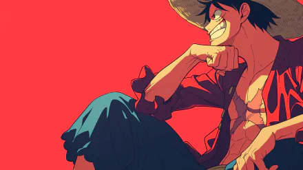 A vibrant HD desktop wallpaper featuring Monkey D. Luffy from One Piece, showcasing his energetic smile and iconic straw hat against a striking red background.