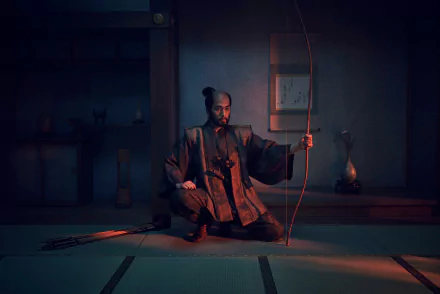 HD Wallpaper featuring a scene from Shogun 2024 TV Show with a character holding a traditional bow in a dimly lit room