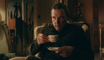 HD desktop wallpaper featuring a scene from the TV show The Gentlemen (2024) with a character thoughtfully sipping tea.