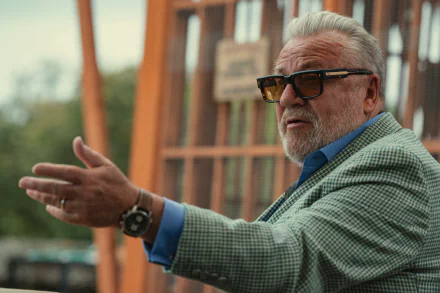 HD wallpaper from The Gentlemen (2024) TV show featuring a well-dressed character gesturing during a scene.