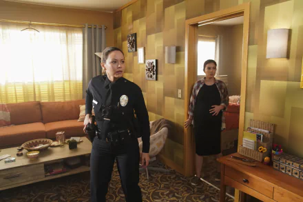 HD wallpaper featuring a scene from The Rookie TV show with a police officer in a living room setting for desktop background.