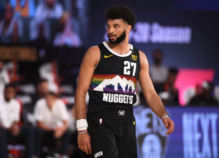 HD desktop wallpaper featuring Denver Nuggets player Jamal Murray on the basketball court, showcasing team colors and logo.