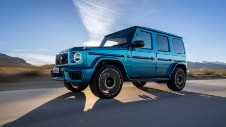 Blue Mercedes-AMG G63 in motion, captured as high-definition desktop wallpaper with a dynamic background.