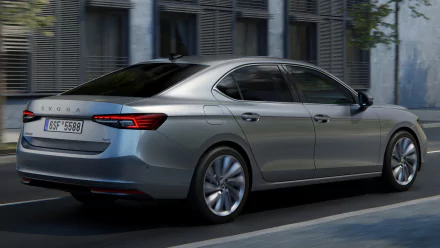 Škoda Superb car in motion on city streets as an HD desktop wallpaper and background