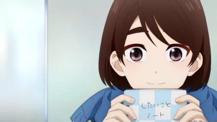 HD wallpaper of Hotaru Hinase from A Condition Called Love anime, featuring a close-up of the character smiling and holding a note.