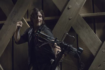 Daryl Dixon from The Walking Dead TV show brandishing a crossbow, featured in HD desktop wallpaper.