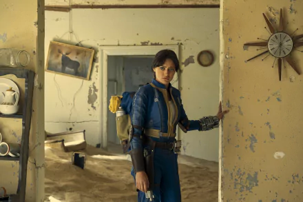 HD wallpaper featuring a character from the TV show Fallout in a blue suit, standing in a dilapidated room with vintage decor elements.