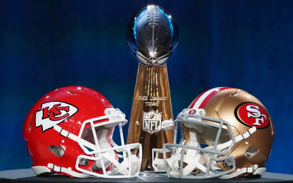 HD wallpaper featuring Kansas City Chiefs and San Francisco 49ers helmets flanking the NFL Super Bowl trophy, representing the pinnacle of football sports achievement.