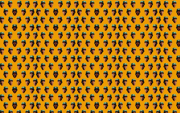 HD wallpaper featuring a vibrant orange background adorned with a repeating pattern of Tyler the Creator's face, celebrating his impact in music and rap culture.