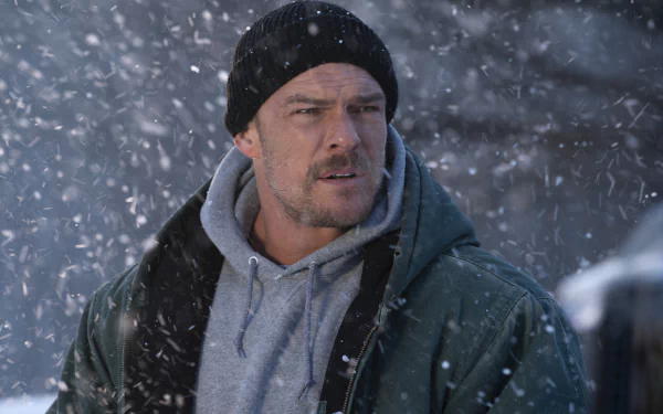 HD wallpaper of a man from the movie Ordinary Angels, featuring an intense expression in a snowy setting.