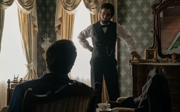 Scene from the TV show Manhunt (2024) featuring two characters in a Victorian-style room, suitable as an HD desktop wallpaper and background.
