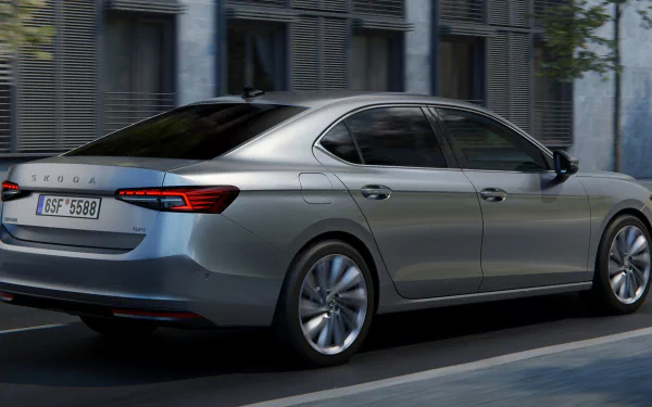 Škoda Superb car in motion on city streets as an HD desktop wallpaper and background