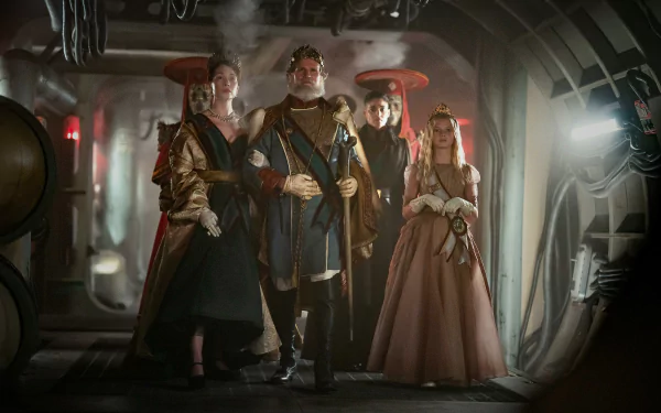 HD desktop wallpaper featuring a group of fictional characters in costume from the movie Rebel Moon - Part Two: The Scargiver, standing in a spaceship corridor.