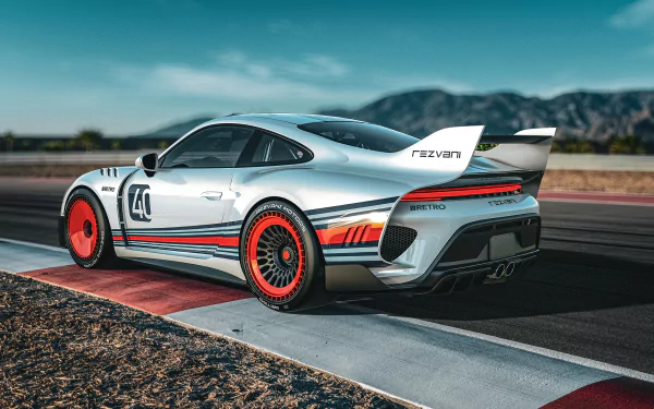 HD wallpaper featuring a Rezvani Retro RR1 sports car parked on a racetrack, showcasing its sleek design and racing livery.
