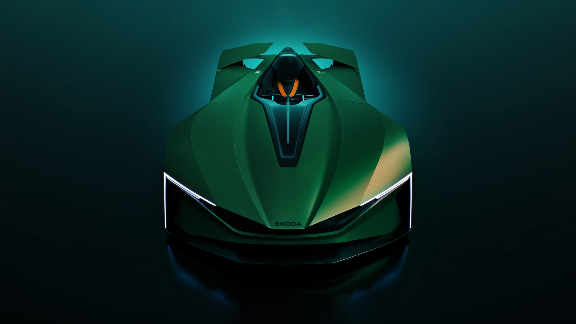HD desktop wallpaper featuring a green Škoda Vision GT concept car with sleek headlights and a futuristic design, set against a dark background.
