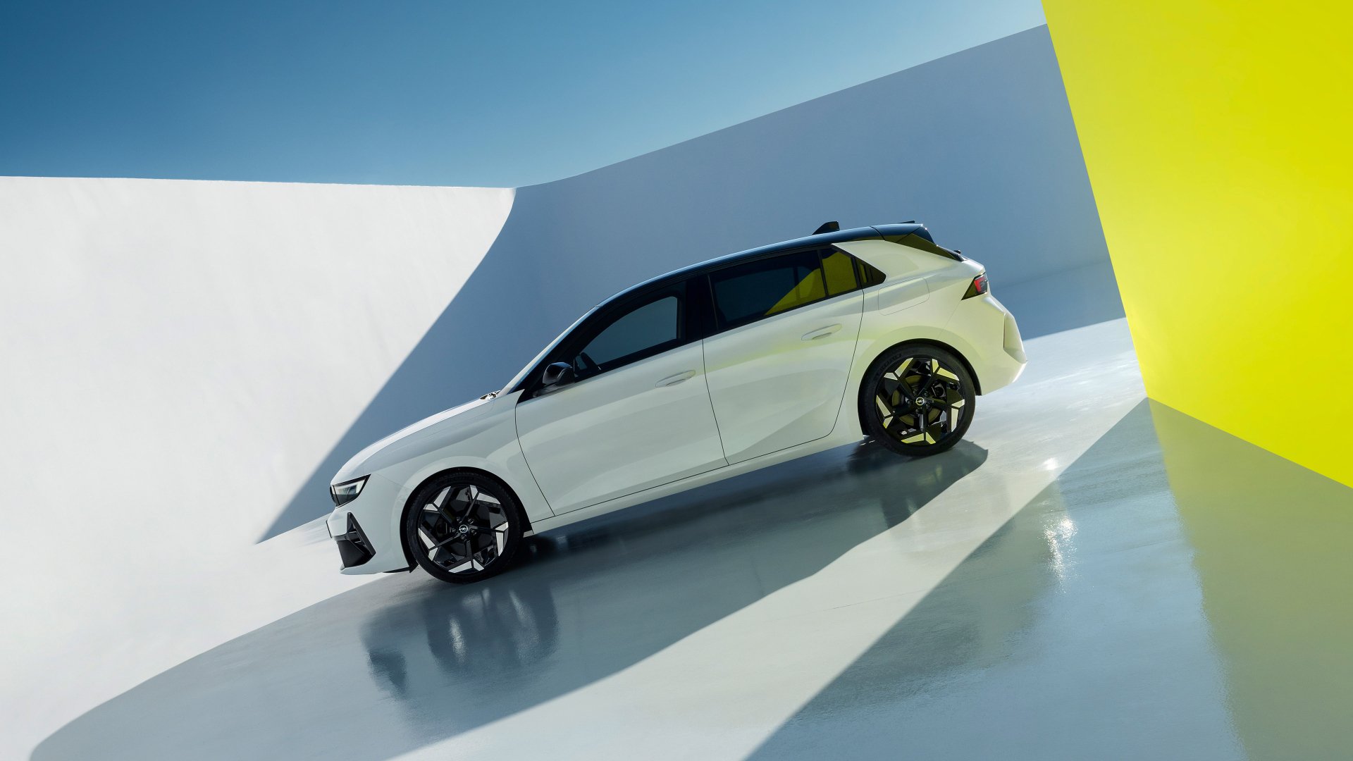 HD desktop wallpaper featuring a sleek white Opel Astra GSe in an abstract setting with clean lines and vibrant lighting.