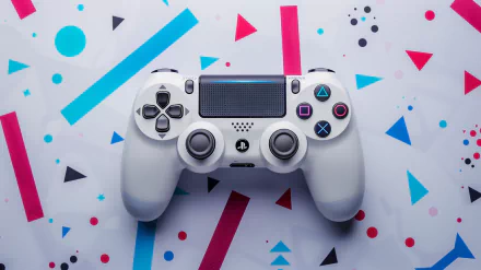 A sleek white PlayStation controller rests on a geometric background with vibrant colors, capturing the essence of gaming culture in this HD desktop wallpaper.