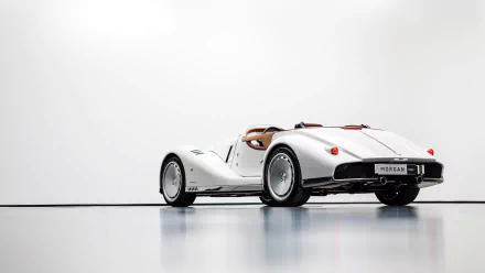 HD desktop wallpaper featuring a white Morgan Midsummer car against a minimalist background. The vehicle is showcased with a sleek, classic design, emphasizing its timeless elegance and style.