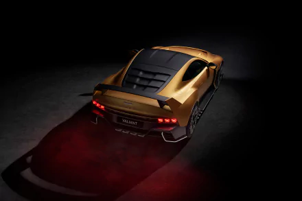HD desktop wallpaper featuring the sleek and powerful Aston Martin Valiant, captured from a rear angle, showcasing its dynamic design and illuminated taillights against a dark background.