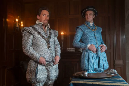 Two men in elaborate period costumes stand in a dimly lit, wood-paneled room. This HD desktop wallpaper and background is inspired by the movie My Lady Jane.