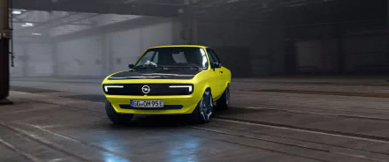 Opel Manta GSe in a high-definition desktop wallpaper and background, featuring a yellow car with sleek, modern design in an industrial setting.