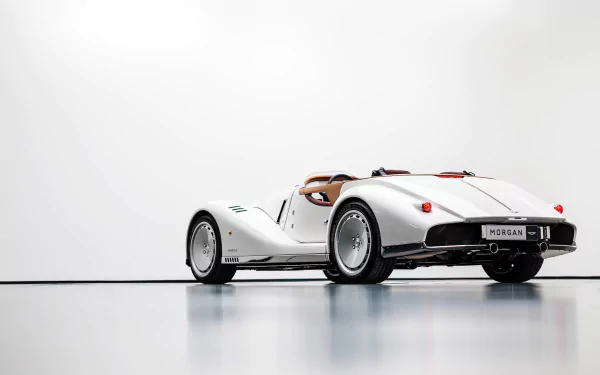 HD desktop wallpaper featuring a white Morgan Midsummer car against a minimalist background. The vehicle is showcased with a sleek, classic design, emphasizing its timeless elegance and style.