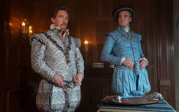 Two men in elaborate period costumes stand in a dimly lit, wood-paneled room. This HD desktop wallpaper and background is inspired by the movie My Lady Jane.